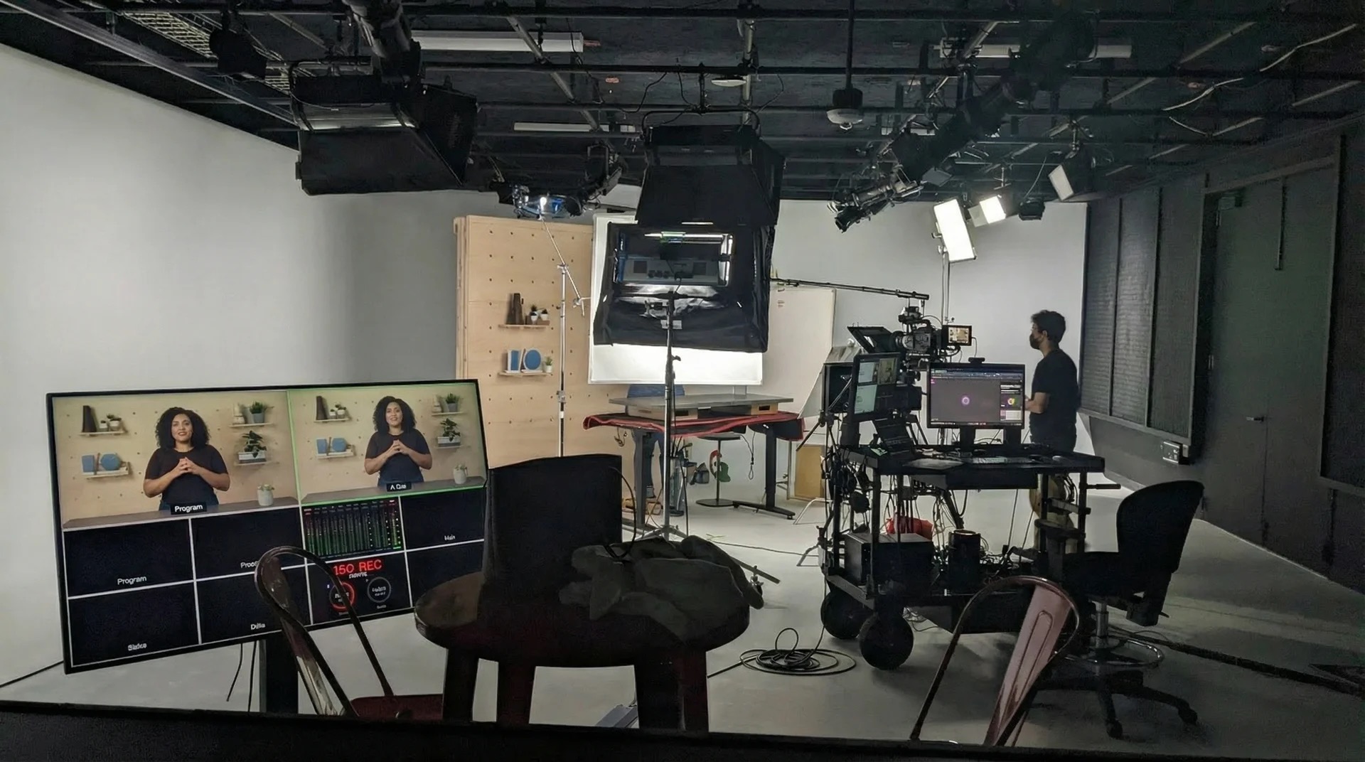 Remote studio setup with control monitors and lighting grid